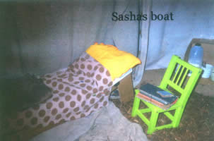 A picture of a bed with Sasha's Boat written in it